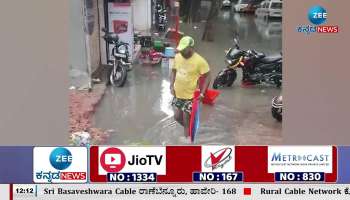 Heavy rain in Bangalore men fall down into manhole