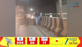 Young women and a young man clash on a flyover in Hassan