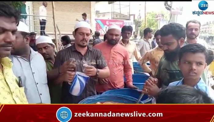 Muslim boys serve cold drinks during Shobha yatre